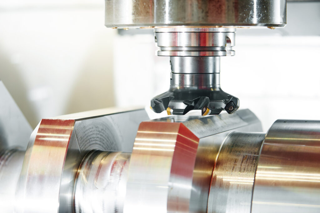 CNC milling head machining a titanium alloy workpiece at Neo Industries Corp